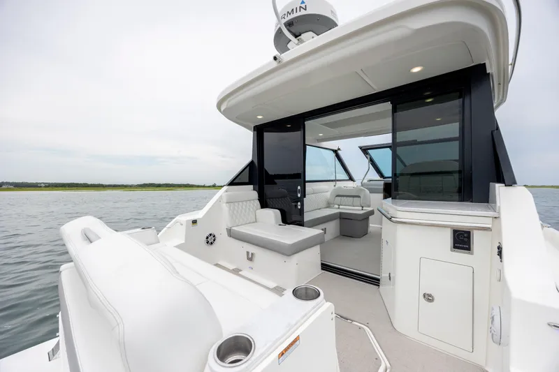  Yacht Photos Pics 2022 Regal 36 Grande Coupe luxury yacht interior with open seating area.