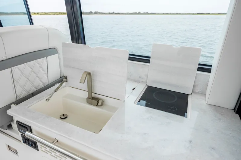  Yacht Photos Pics Luxury yacht kitchen with sink and stove, 2022 Regal 36 Grande Coupe.