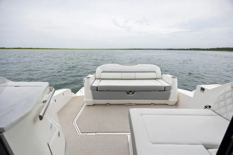  Yacht Photos Pics 2022 Regal 36 Grande Coupe boat interior with luxurious seating and scenic water view.