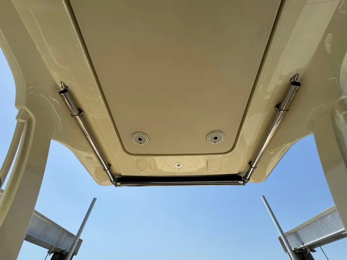  Yacht Photos Pics 2020 Chris-Craft Launch 31 GT boat roof with hydraulic supports against clear sky.