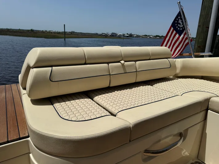  Yacht Photos Pics 2020 Chris-Craft Launch 31 GT boat with beige seating and American flag.