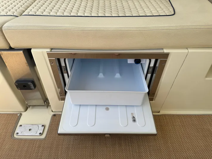  Yacht Photos Pics Open storage compartment on 2020 Chris-Craft Launch 31 GT boat with beige seating.