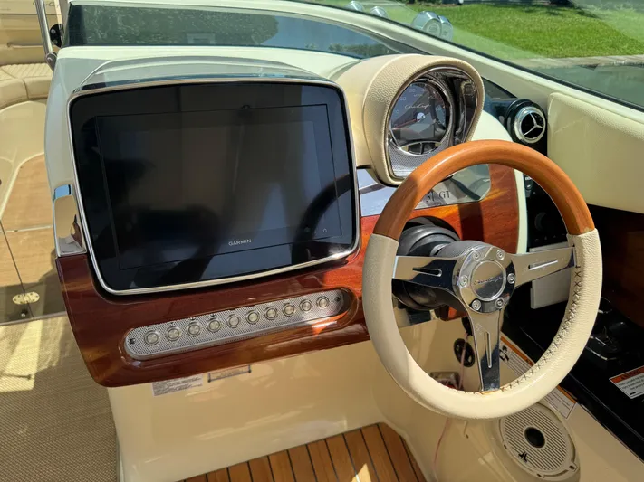  Yacht Photos Pics 2020 Chris-Craft Launch 31 GT dashboard with modern controls and wooden accents.