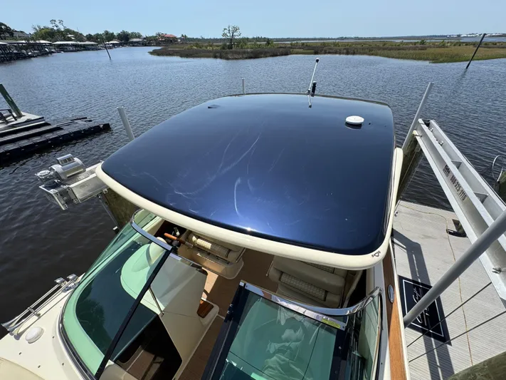  Yacht Photos Pics 2020 Chris-Craft Launch 31 GT boat docked on a serene lake.