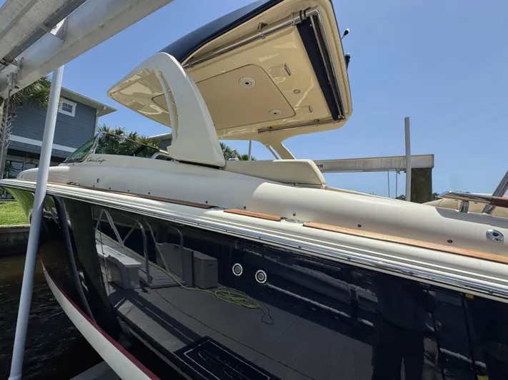  Yacht Photos Pics 2020 Chris-Craft Launch 31 GT boat docked under a clear blue sky.