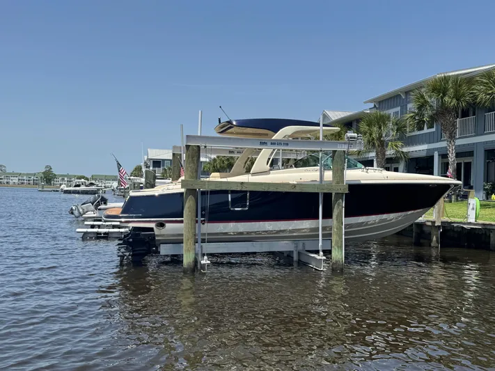  Yacht Photos Pics 2020 Chris-Craft Launch 31 GT boat docked on a sunny waterfront.