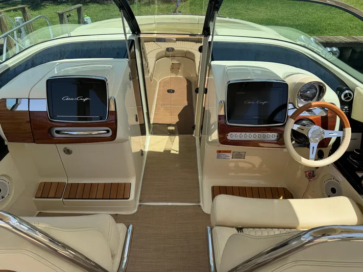  Yacht Photos Pics 2020 Chris-Craft Launch 31 GT interior with elegant dashboard and steering wheel design.
