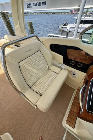  Yacht Photos Pics 2020 Chris-Craft Launch 31 GT boat interior with beige seating and wood accents.