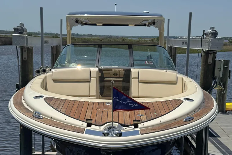  Yacht Photos Pics 2020 Chris-Craft Launch 31 GT boat docked, featuring elegant wood deck and seating.
