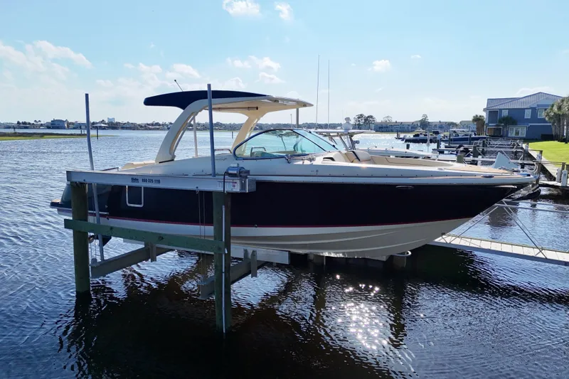  Yacht Photos Pics 2020 Chris-Craft Launch 31 GT boat docked on a sunny waterfront.