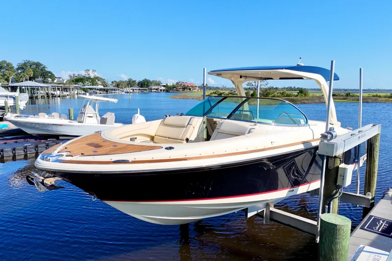  Yacht Photos Pics 2020 Chris-Craft Launch 31 GT boat docked on a sunny day by the water.