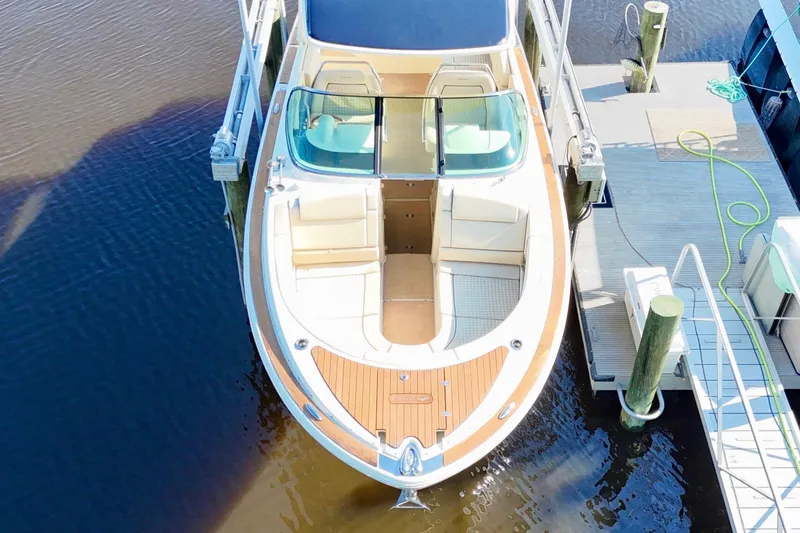  Yacht Photos Pics 2020 Chris-Craft Launch 31 GT boat docked, aerial view showcasing elegant design and spacious seating.