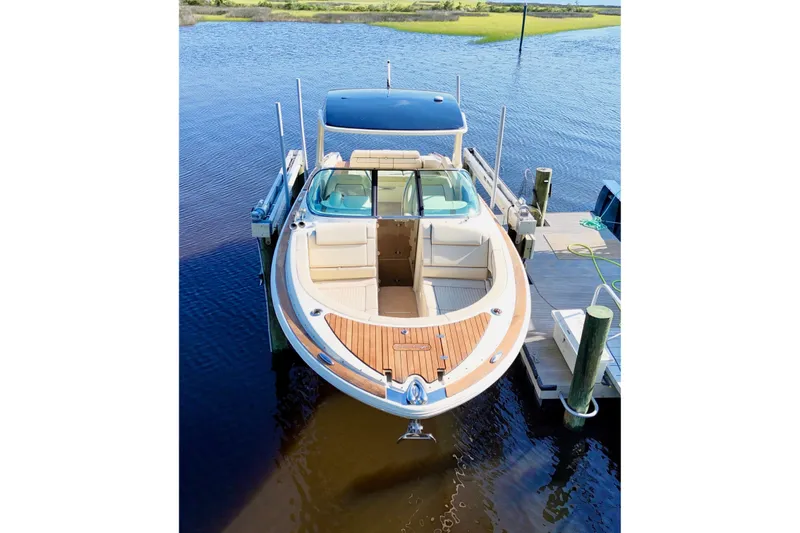  Yacht Photos Pics 2020 Chris-Craft Launch 31 GT boat docked on calm water.