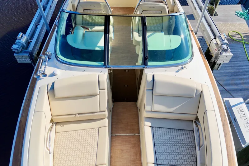  Yacht Photos Pics 2020 Chris-Craft Launch 31 GT boat interior with beige seating and glass windshield.