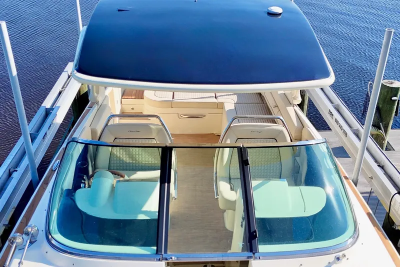  Yacht Photos Pics 2020 Chris-Craft Launch 31 GT boat docked, featuring elegant seating and sleek design.