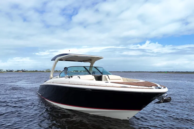  Yacht Photos Pics 2020 Chris-Craft Launch 31 GT boat on open water under a cloudy sky.