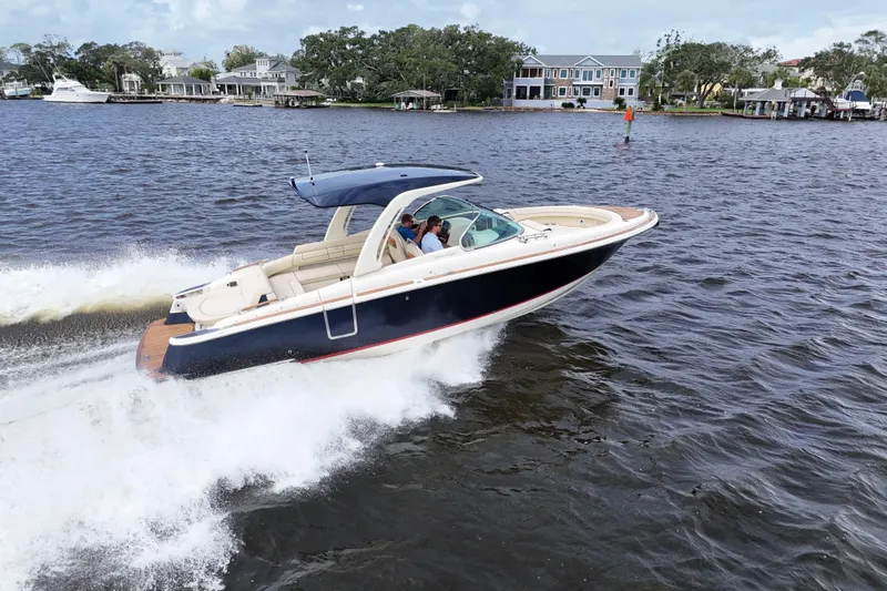  Yacht Photos Pics 2020 Chris-Craft Launch 31 GT cruising on a scenic waterway.