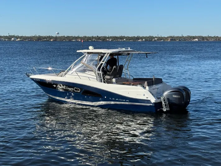 Make It Happen Yacht Photos Pics 2022 Jeanneau Leader 9.0 WA boat on calm water with Yamaha outboard.