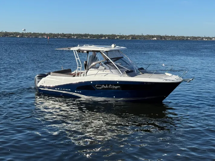 Make It Happen Yacht Photos Pics 2022 Jeanneau Leader 9.0 WA boat on calm water, sunny day.