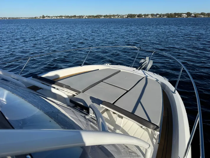 Make It Happen Yacht Photos Pics 2022 Jeanneau Leader 9.0 WA boat on calm water, featuring spacious deck and sleek design.