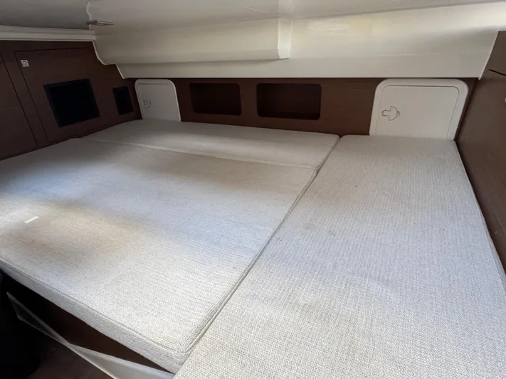 Make It Happen Yacht Photos Pics 2022 Jeanneau Leader 9.0 WA cabin interior with spacious bed and modern design.