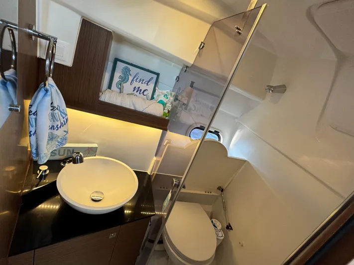 Make It Happen Yacht Photos Pics Modern bathroom in 2022 Jeanneau Leader 9.0 WA boat with sink and toilet.