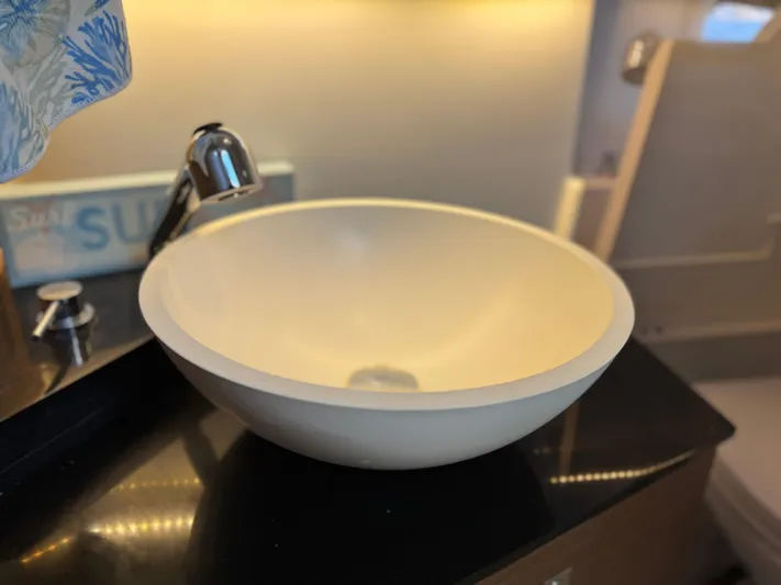 Make It Happen Yacht Photos Pics Modern sink in 2022 Jeanneau Leader 9.0 WA boat interior.