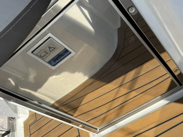 Make It Happen Yacht Photos Pics 2022 Jeanneau Leader 9.0 WA boat with teak flooring and Vitrifrigo fridge.