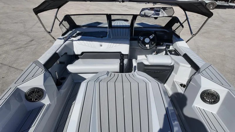  Yacht Photos Pics 2026 Nautique Ski boat interior with sleek seating and modern dashboard design.