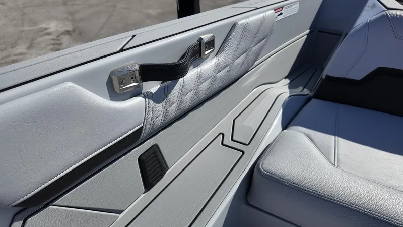  Yacht Photos Pics 2026 Nautique Ski boat interior with sleek, modern upholstery and stylish design elements.