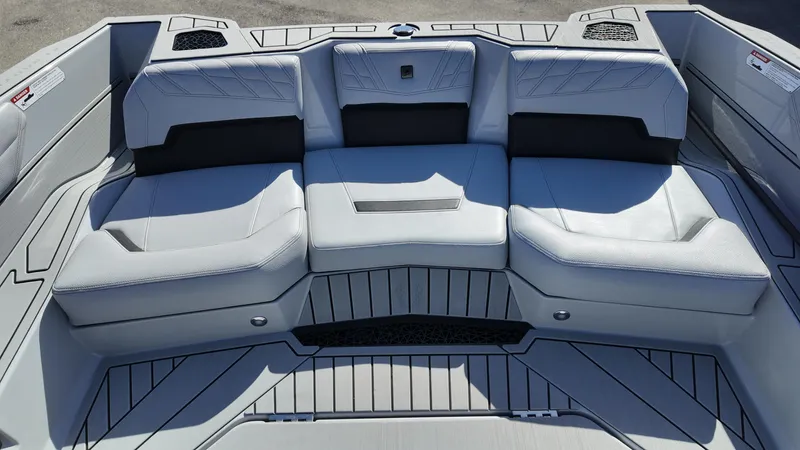  Yacht Photos Pics 2026 Nautique Ski boat interior with sleek, modern seating design.