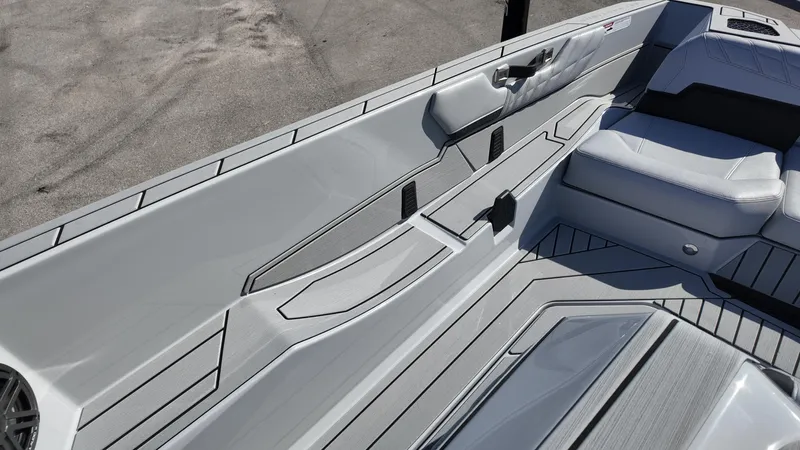  Yacht Photos Pics 2026 Nautique Ski boat interior with sleek gray seating and modern design.
