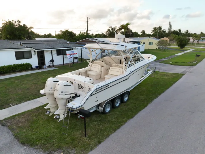 Sweet Life Yacht Photos Pics 2019 Grady-White Freedom 325 boat on trailer in residential area.