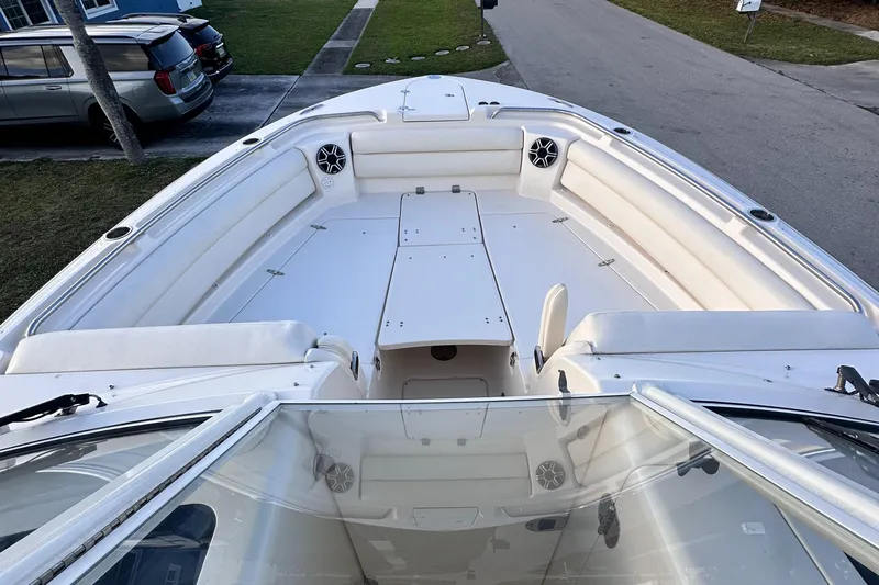 Sweet Life Yacht Photos Pics 2019 Grady-White Freedom 325 boat interior with spacious seating and sleek design.