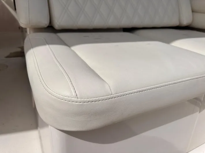 Sweet Life Yacht Photos Pics 2019 Grady-White Freedom 325 boat seat with white upholstery and diamond stitching.