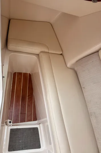 Sweet Life Yacht Photos Pics 2019 Grady-White Freedom 325 interior with beige seating and wood flooring.