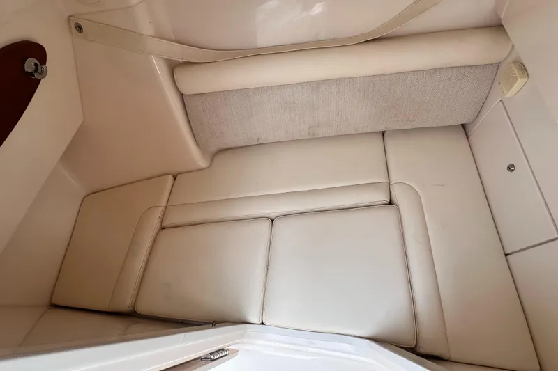 Sweet Life Yacht Photos Pics 2019 Grady-White Freedom 325 interior cabin with beige cushioned seating.