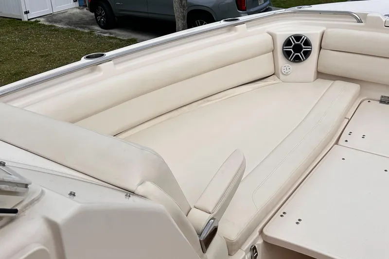 Sweet Life Yacht Photos Pics 2019 Grady-White Freedom 325 boat interior with beige seating and speaker.
