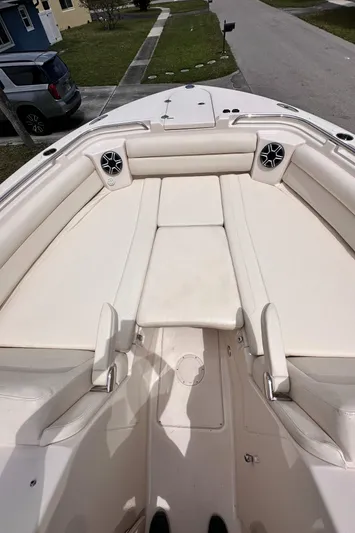 Sweet Life Yacht Photos Pics 2019 Grady-White Freedom 325 boat interior with cushioned seating and speakers.