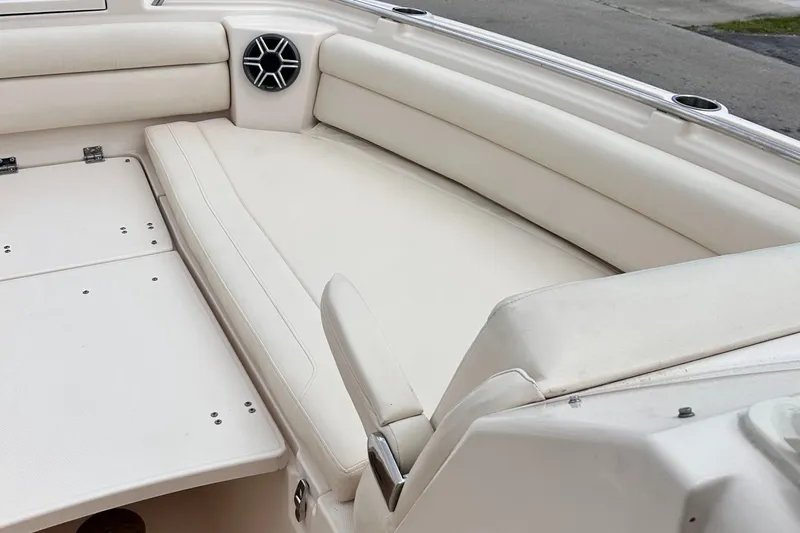 Sweet Life Yacht Photos Pics 2019 Grady-White Freedom 325 boat interior with white cushioned seating.