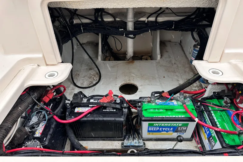 Sweet Life Yacht Photos Pics 2019 Grady-White Freedom 325 boat battery compartment with multiple batteries and wiring.