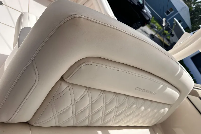 Sweet Life Yacht Photos Pics Luxurious white leather seating on a 2019 Grady-White Freedom 325 boat.
