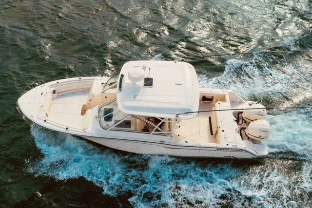 Sweet Life Yacht Photos Pics 2019 Grady-White Freedom 325 boat cruising on open water.