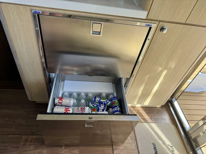 Roosterfish Yacht Photos Pics Stainless steel drawer fridge on Aquila 44 yacht, stocked with drinks, 2022 model.