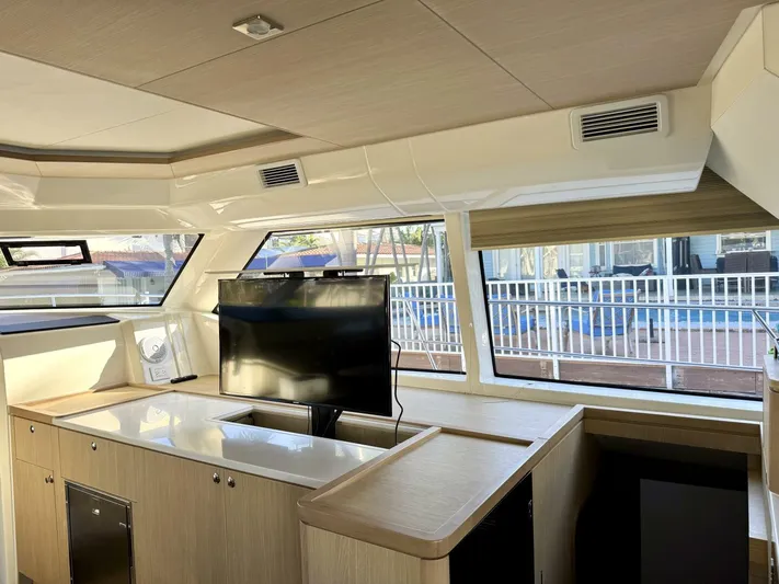 Roosterfish Yacht Photos Pics Interior of 2022 Aquila 44 yacht with modern design and large windows.