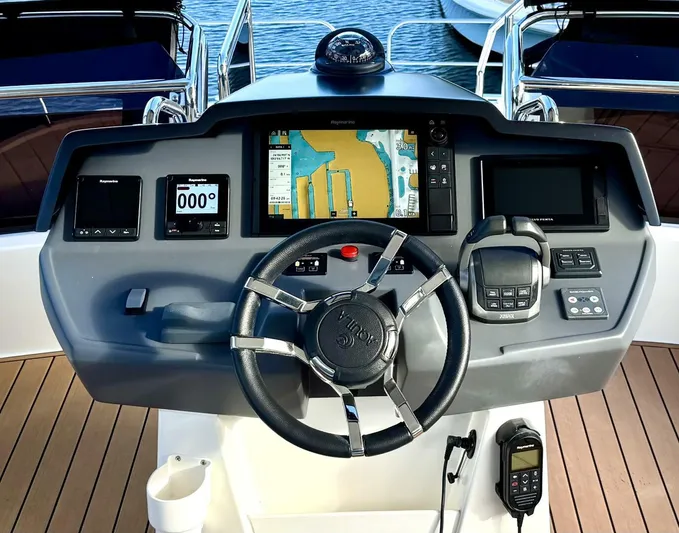 Roosterfish Yacht Photos Pics Helm of 2022 Aquila 44 yacht with navigation system and controls.