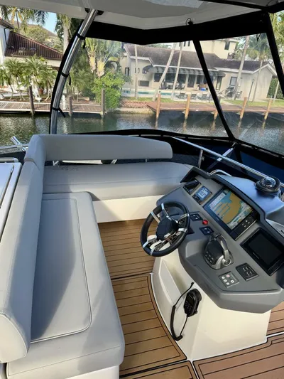 Roosterfish Yacht Photos Pics 2022 Aquila 44 yacht helm with modern navigation system and comfortable seating.