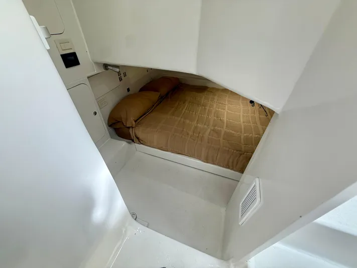 Reel Conversation Yacht Photos Pics 2023 Millennium Marine NuWave 37 cabin interior with a cozy bed and modern design.