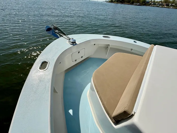 Reel Conversation Yacht Photos Pics 2023 Millennium Marine NuWave 37 boat, featuring a spacious deck and comfortable seating on calm waters.