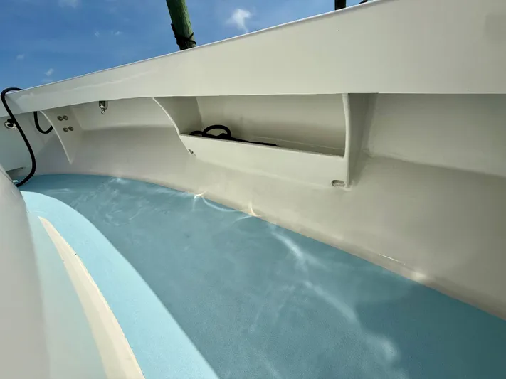 Reel Conversation Yacht Photos Pics 2023 Millennium Marine NuWave 37 boat interior with sleek white and blue design.